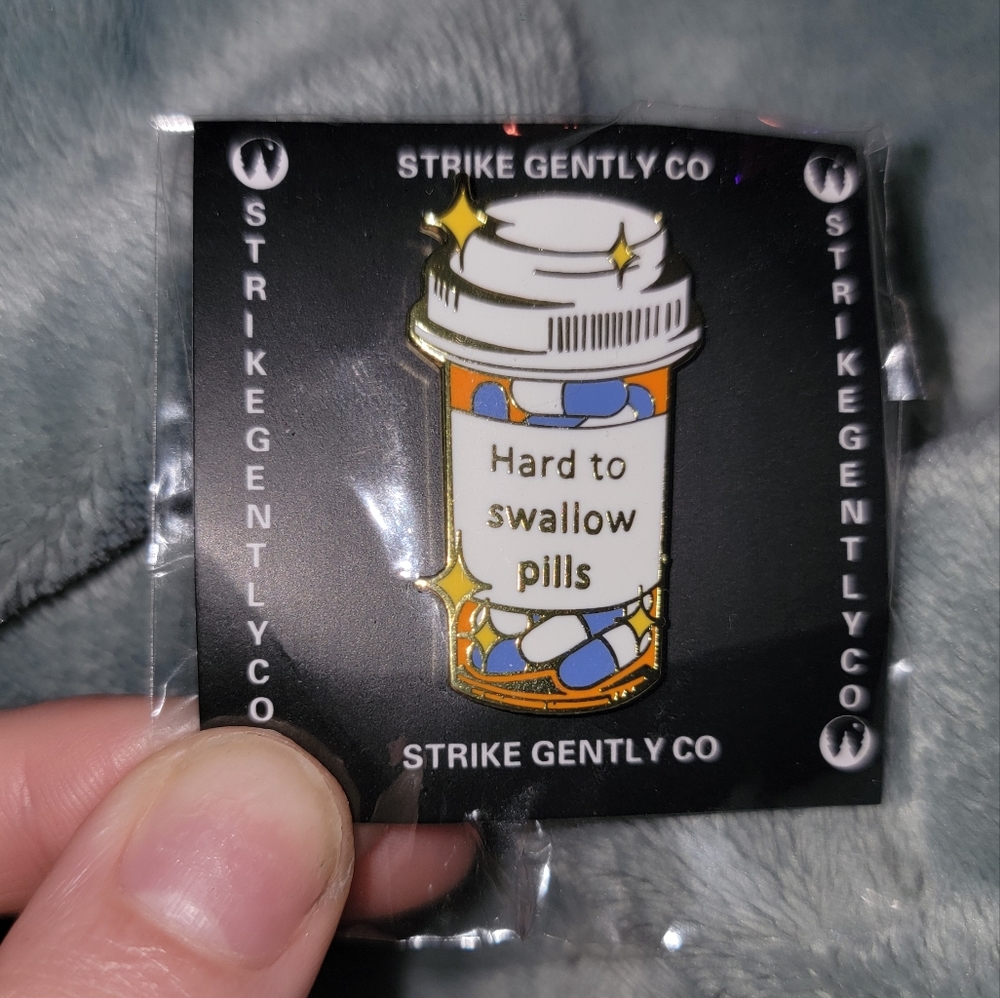 Strike Gently Co Hard to Swallow Pills enamel pin